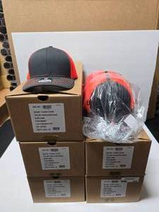lot 320 image: Richardson 112 Neon OrangeCharcoal Snapback Trucker Hats.  Approx 24 Per Box  QUANTITY 5 BOXES  BID IS TIMES THE QUANTITY