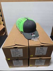 lot 319 image: Richardson 112 Neon GreenCharcoal Snapback Trucker Hats.  Approx 24 Per Box  QUANTITY 4 BOXES  BID IS TIMES THE QUANTITY