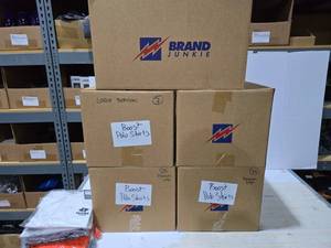 lot 338 image: 5 Boxes of Misc Boost Mobile Polo Shirts & Soft Shell Jackets.  SEE PICS FOR STYLES INCLUDED