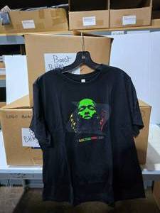 lot 343 image: 3 Boxes of Black History Month Shirts.  Approx 100 Shirts Per Box.