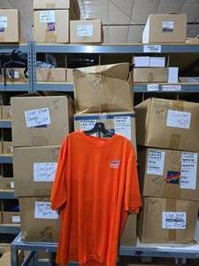 lot 399 image: Large Lot of 10 Boxes of Orange Silver Eagle Dri-Fit Shirts.  Approx 600 Shirts