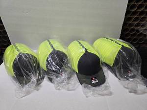 lot 532 image: Richardson 112 Snapback Trucker Hats, CharcoalNeon.  Approx 12 Hats Per Pack  QUANTITY 4 PACKS  BID IS TIMES THE QUANTITY