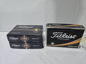 lot 555 image: Titleist Pro V1 Golf Balls.  12 Balls Per Box  QUANTITY 3 BOXES  BID IS TIMES THE QUANTITY