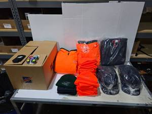 lot 560 image: Large Lot of Misc Silver Eagle Beanies, Jackets, Hats, Koozies & Games