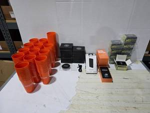 lot 591 image: Large Lot of Misc Superior Cups, Wireless Charging Stations, Power Banks & Wearable Speakers.