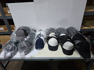 lot 604 image: Large Lot of Misc Hats.  Outdoor Cap & More.  Approx 12 Hats Per Pack  QUANTITY 11 PACKS  BID IS TIMES THE QUANTITY