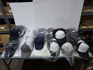 lot 605 image: Large Lot of Misc Hats.  Outdoor Cap & More.  Approx 12 Hats Per Pack  QUANTITY 15 PACKS  BID IS TIMES THE QUANTITY