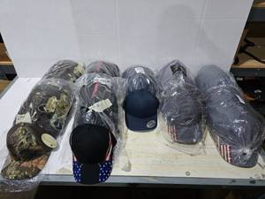 lot 607 image: Large Lot of Misc Hats.  Includes Mossy Oak, Yupoong, Outdoor Cap & More.  Approx 12 Hats Per Pack  QUANTITY 9 PACKS  BID IS TIMES THE QUANTITY