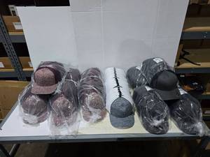 lot 608 image: Large Lot of Pacific & Yupoong Hats.  Includes Pacific Maroon HeatherWhite (6 Packs), Pacific Charcoal HeatherWhite (2 Packs) Yupoong CharcoalBlack (4 Packs)  Approx 12 Hats Per Pack  QUANTITY 12 PACKS  BID IS TIMES THE QUANTITY