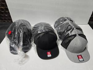 lot 562 image: Lot of 32 Richardson 511 Flat Bill Snapback Trucker Hats.