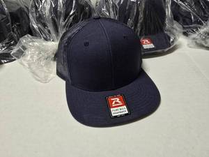 lot 613 image: Richardson 511 Flat Bill Snapback Trucker Hat NavyNavy.  Approx 12 Hats Per Pack  QUANTITY 4 PACKS  BID IS TIMES THE QUANTITY