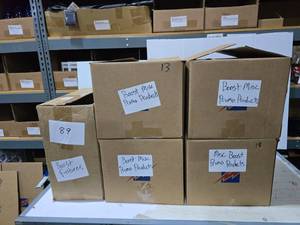 lot 646 image: 5 Boxes of Misc Boost Mobile Promotional Products.  Includes Frisbees, Pens, Stress Balls, Lanyards, Koozies, Cups, Lip Balm, Drawstring Backpacks, Sunglasses & MORE