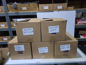 lot 650 image: 5 Boxes of Misc Boost Mobile Promotional Shirts, Vests & Jackets.  SEE PICS FOR STYLES