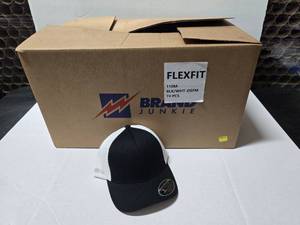 lot 664 image: Flexfit 110 BlackWhite Mesh Hats.  Approx 12 Hats Per Pack.  QUANTITY 6 PACKS  BID IS TIMES THE QUANTITY SO YOU ARE BIDDING PER PACK