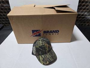 lot 684 image: Outdoor Cap 315M Mossy Oak Mesh Trucker Hat.  Approx 12 Hats Per Pack  QUANTITY 6 PACKS  BID IS TIMES THE QUANTITY