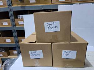 lot 698 image: 3 Boxes of Misc Boost Mobile Shirts.  SEE PICS FOR STYLES