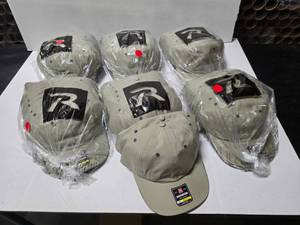 lot 701 image: Richardson 155 Lite Trail Hat, TanCharcoal.  Approx 12 Hats Per Pack  QUANTITY 6 PACKS  BID IS TIMES THE QUANTITY