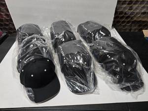 lot 712 image: Richardson R78 BlackWhite Hats.  Approx 12 Hats Per Pack.  QUANTITY 6 PACKS  BID IS TIMES THE QUANTITY