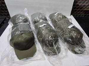 lot 715 image: Outdoor Cap USA-750M Olive Debossed American Flag Hats.  Approx 12 Hats Per Pack.  QUANTITY 6 PACKS  BID IS TIMES THE QUANTITY