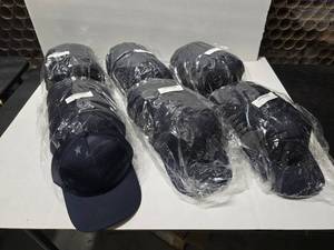 lot 716 image: Outdoor Cap USA-750M Navy Debossed American Flag Hats.  Approx 12 Hats Per Pack.  QUANTITY 6 PACKS  BID IS TIMES THE QUANTITY