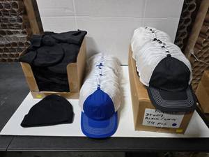 lot 810 image: Lot of Misc District Hats & Beanies.  Includes Beanies (Qty 52), RoyalWhite Hats (Qty 30) & BlackWhite Hats (Qty 56)