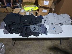 lot 829 image: MASSIVE Lot of Approx 200 Misc Port Authority Polos, Cutter & Buck Polos & District Blue Shirts