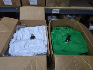 lot 864 image: 2 Boxes of Antiqua Polo Shirts.  1 Box of White & 1 Box of Green