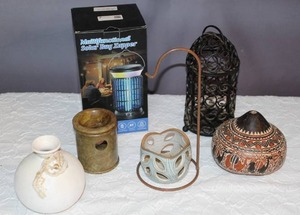lot 53 image: This is a hand-carved Peruvian gourd, also known as a mate burilado, a traditional form of folk art from Peru. And Solar bug zapper  and more see pictures