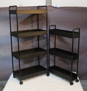 lot 54 image: Two plastic rolling shelves put together for picture