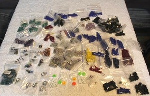 lot 55 image: jewelry-making supplies including sterling, semi-precious gemstone, and glass beads, among other items.