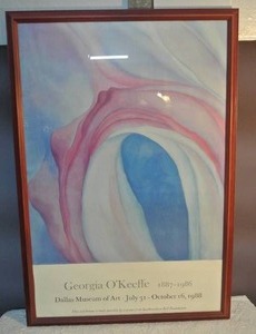 lot 80 image: a framed poster advertising a Georgia OKeeffe music pink and blue ll