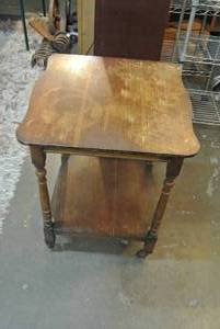lot 108 image: antique Wood side table about 2 foot tall on Wheels