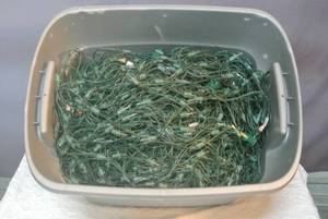 lot 128 image: Tote full of Christmas lights