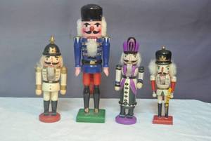 lot 157 image: 4 nutcrackers one about 14 inches tall the other 3 is about 9 inches tall see all pictures