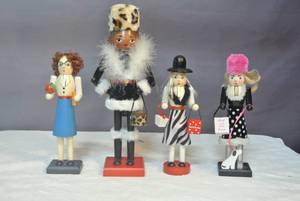 lot 190 image: 4- nutcrackers ladys shopping and teacher they range from about 14 inches tall to about 10 inches tall