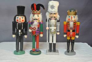 lot 194 image: 4- nutcrackers they  range from about 15 inches tall to about 13 inches
