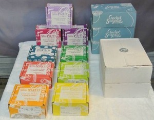 lot 197 image: Yarn subscription boxes with a lot of cool things in them still pictures of all boxes open