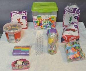 lot 212 image: Craft lot tub of wood beads & tie dye  block party kit & floss string & fabric strips and so much more see pictures