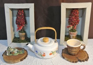 lot 236 image: Tulip Teapot Indonesia Vintage Enameled Six Cup, two shadow box pictures,and to wood rounds and a frog figure and a coffee cup