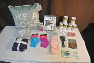 lot 248 image: Like a boss pillow and two packs of washcloth, socks, shower curtain hooks and much more