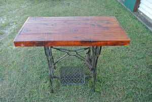 lot 262 image: a table created from a repurposed antique Singer sewing machine base with a new wooden tabletop.