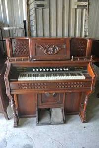 lot 269 image: a pump organ, also known as a reed organ.