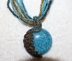 lot 136 image: Jewelry, animal themed multistrand peacock pendant necklace