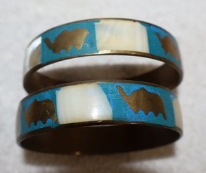 lot 144 image: Jewelry, animal themed brass bangle bracelets with shell inlays