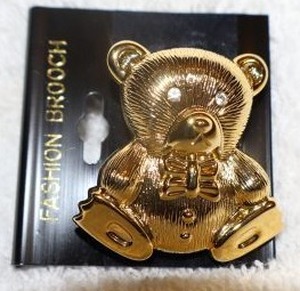 lot 146 image: Jewelry, animal themed Golden teddy bear pin