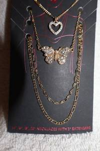 lot 152 image: Jewelry, animal themed gold tone necklaces