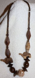 lot 156 image: Jewelry, animal themed wood and wood carved elephant bead necklace