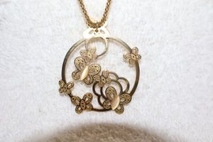 lot 161 image: Jewelry, animal themed Golden butterfly pendant necklace