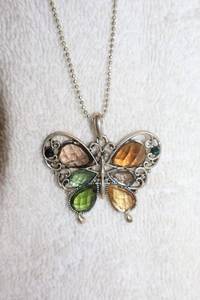 lot 165 image: Jewelry, animal themed Butterfly pendant necklace