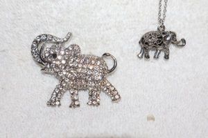 lot 171 image: Jewelry, animal themed elephant beaded magnet and elephant pendant necklace